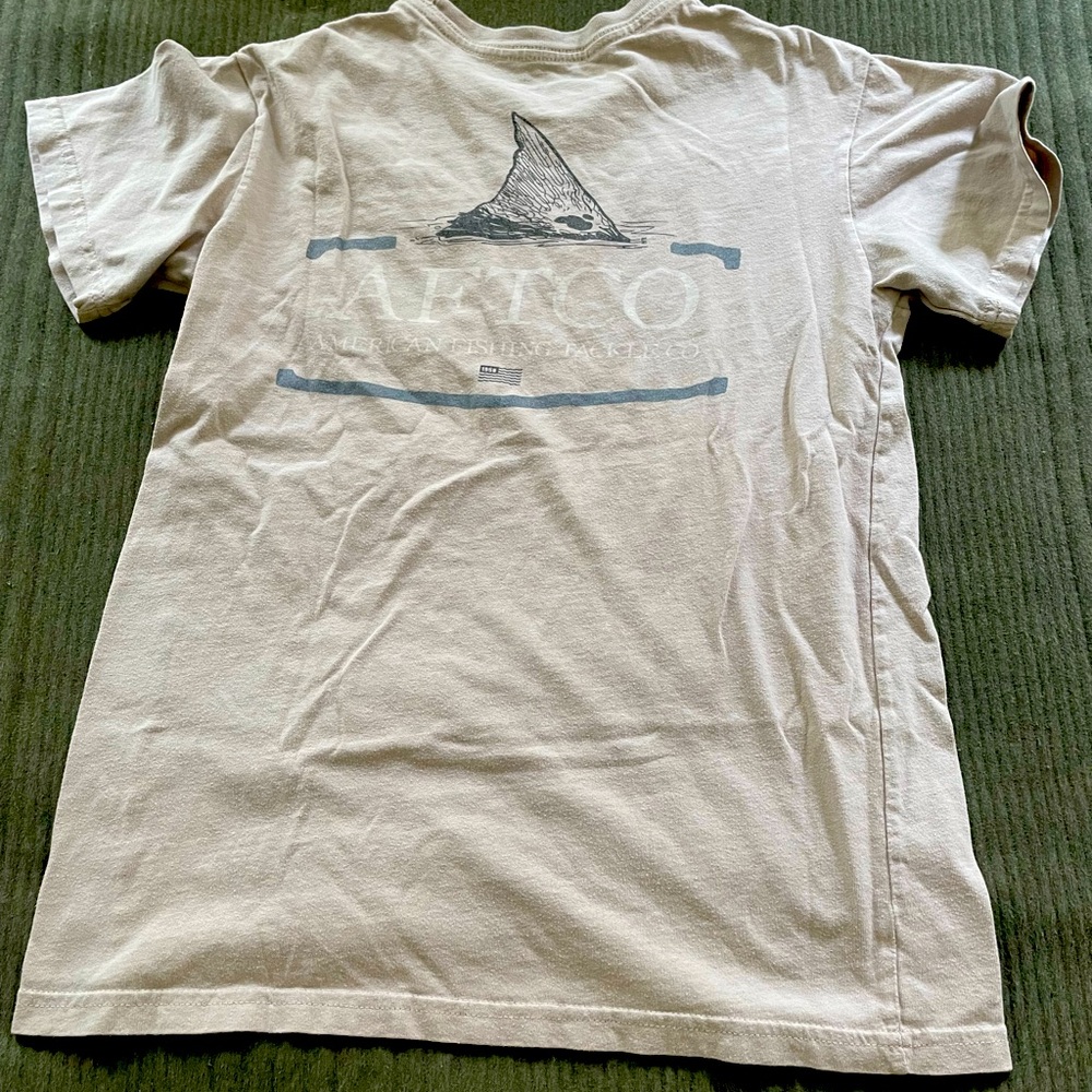 tan aftico tee with light blue on the back